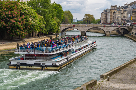 Paris France 2014 April 21,  Tour Boats cruising along the Seine River in Parisのeditorial素材