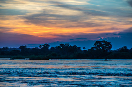 Beautiful Sunset over the Zambezi River, Zambia, The Zambezi is the fourth longest river in Africaの写真素材