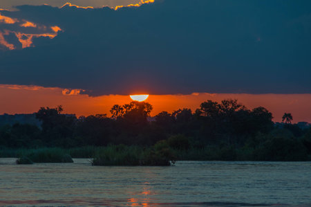 Beautiful Sunset over the Zambezi River, Zambia, The Zambezi is the fourth longest river in Africaの写真素材