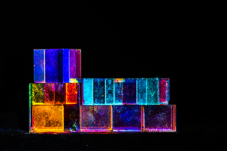 Abstract Cubes concept relecting bright prism colors in unique backgroundの写真素材