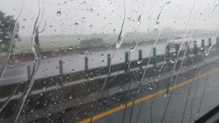Sitting in the car to enjoy the water droplets on the glass