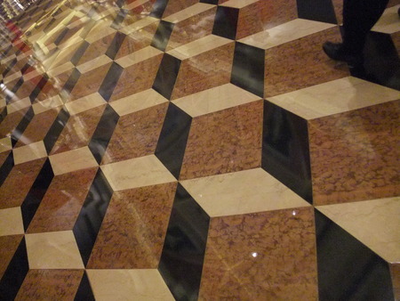 Brown  and biege square tiling on the floorの写真素材