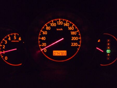 Close up of the car speedometer at nightの写真素材