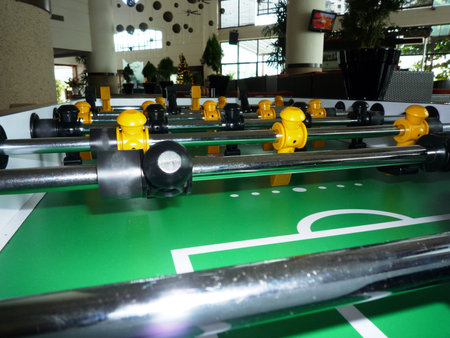 Soccer table game with black and yellow players