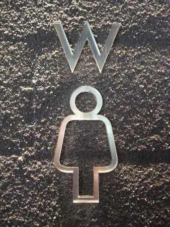Toilet sign on wallの写真素材