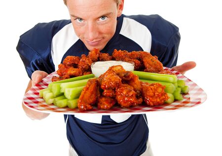 Caucasian American football player, in uniform, isolated on white, with various related props.の写真素材