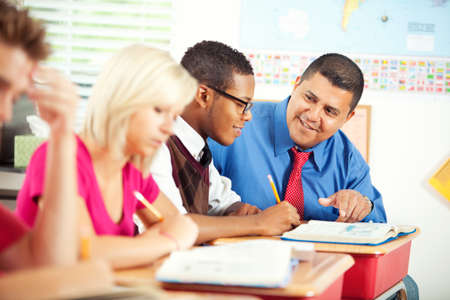Extensive series of a multi-cultural group of students with a teacher, in a high school classroom setting.の写真素材