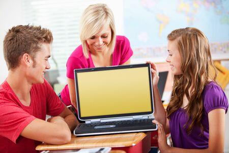 Extensive series of a multi-cultural group of students with a teacher, in a high school classroom setting.の写真素材
