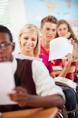 Extensive series of a multi-cultural group of students with a teacher, in a high school classroom setting.の写真素材