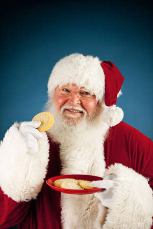 Extensive series of a Caucasian, Authentic Santa Claus Character on a blue background.の写真素材