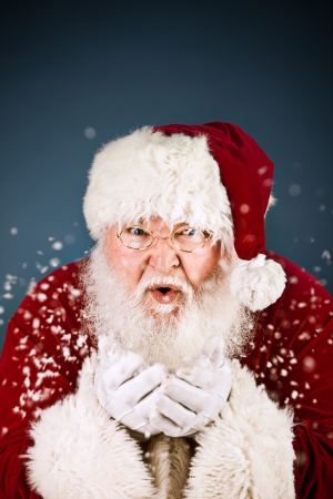 Extensive series of a Caucasian, Authentic Santa Claus Character on a blue background.の写真素材