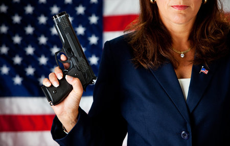 Politician: Holding a Gun to Side