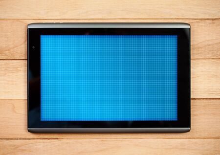 Modern Digital Tablet on wooden background.の写真素材