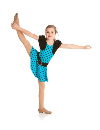Cute Dancer Holding Leg In Airの写真素材