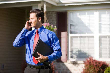 Extensive series of a Caucasian Real Estate Agent and African-American Couple in front of a home.の写真素材