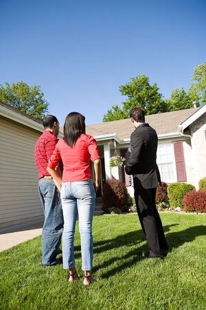 Home: Agent Shows Home to Coupleの写真素材
