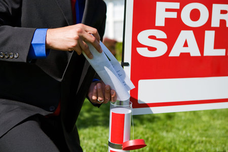 Home: Agent Puts Brochures in Sign Tube