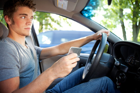 Series with two teens driving in a car.  Includes lots of images with texting and looking at cel...