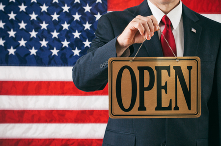 Politician: Man Holding Up Open Business Signの写真素材