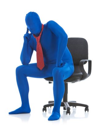 Blue: Thinking Businessman in Chairの写真素材