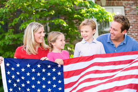 Summer: Family with American Flagの写真素材