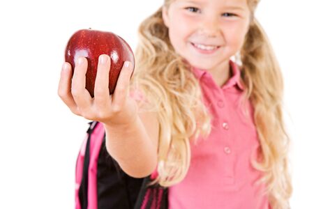 Education: Smiling Girl Bringing Apple For Teacherの写真素材