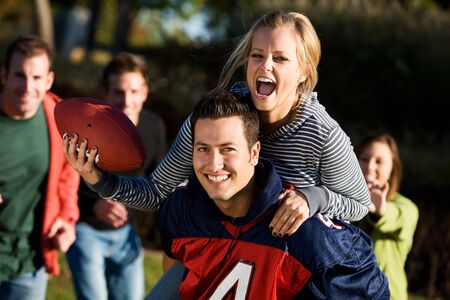 Football: Piggyback Girl Going for Touchdownの写真素材