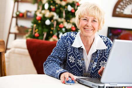 Christmas: Senior Woman Onlineの写真素材
