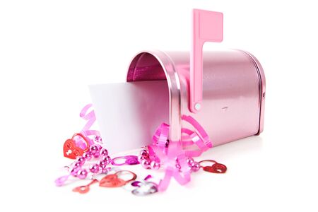 A pink Valentine holiday mailbox with various decorations.の写真素材
