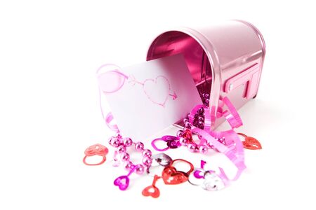 A pink Valentine holiday mailbox with various decorations.の写真素材
