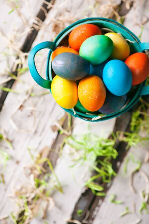 Easter: Colorful Eggs In Basket Surrounded By Grassの写真素材