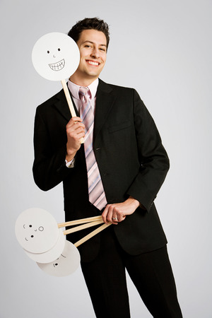 Disguise: Businessman Chooses To Be Happyの写真素材