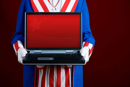 Patriotic: Holding A Laptop With Blank Screenの写真素材