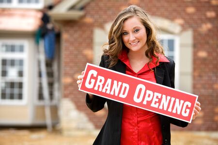 Series at a new home construction site.  Includes construction worker/builder, real estate agents and young Caucasian coupleの写真素材