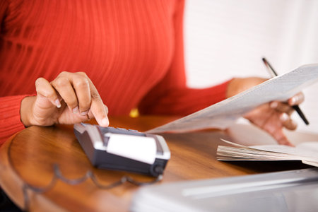 African-American woman working on her US Tax forms.