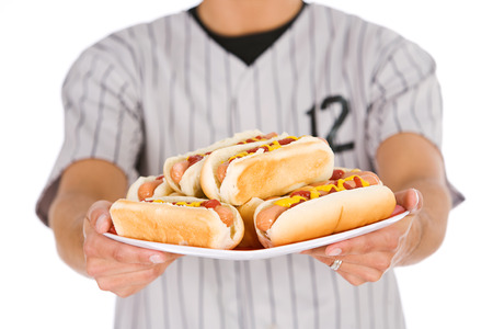 Isolated on white series of two men in baseball uniforms, in various poses with props.の写真素材