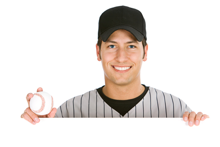 Isolated on white series of two men in baseball uniforms, in various poses with props.の写真素材