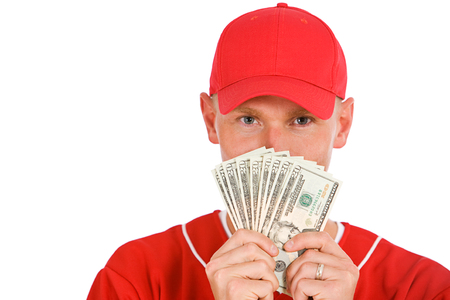 Isolated on white series of two men in baseball uniforms, in various poses with props.の写真素材