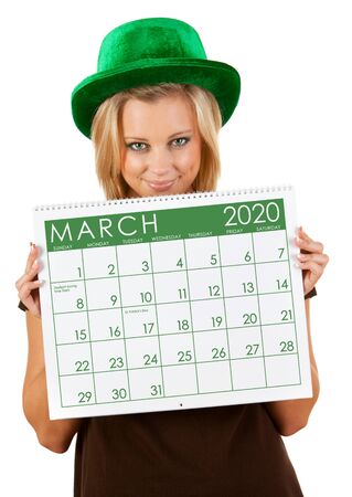 Cute series with a Caucasian woman holding a calendar for different times of the year.の写真素材