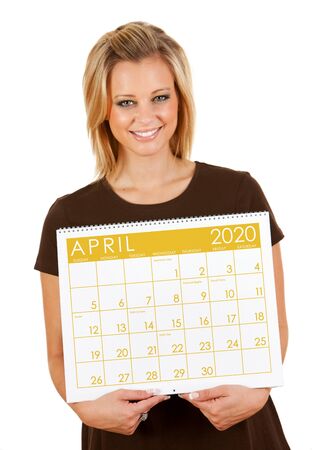Cute series with a Caucasian woman holding a calendar for different times of the year.の写真素材