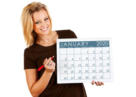 Cute series with a Caucasian woman holding a calendar for different times of the year.の写真素材