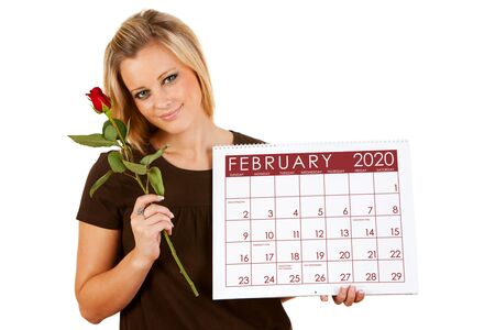 Cute series with a Caucasian woman holding a calendar for different times of the year.の写真素材