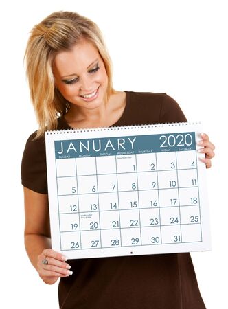 Cute series with a Caucasian woman holding a calendar for different times of the year.の写真素材