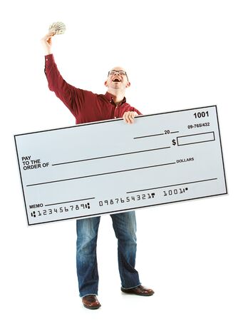 Isolated on white background series of a Caucasian man with an oversized bank check.の写真素材