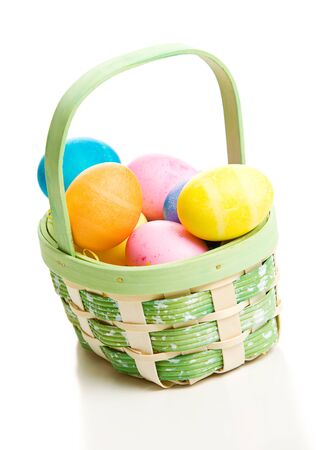 Isolated on White Easter Basket with colored eggs.の写真素材