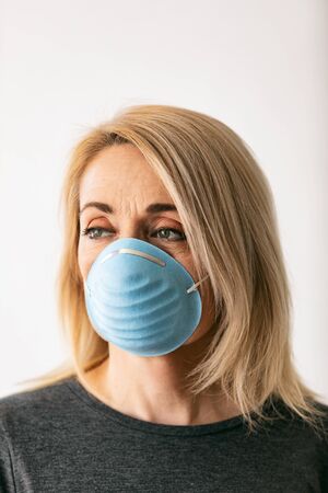 Series on white background and outside, of people wearing medical masks as defense against a virus.の写真素材