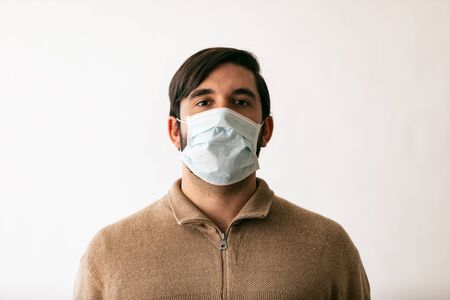Series on white background and outside, of people wearing medical masks as defense against a virus.の写真素材