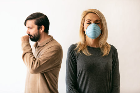 Series on white background and outside, of people wearing medical masks as defense against a virus.の写真素材