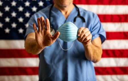 Series with an anonymous doctor in various poses, holding various props.の写真素材