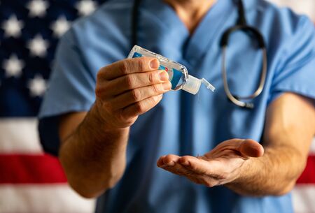 Series with an anonymous doctor in various poses, holding various props.の写真素材